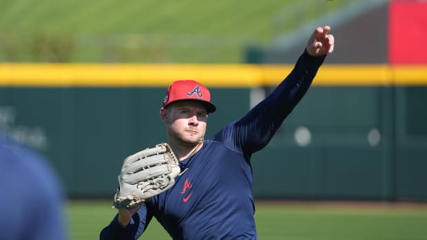 Feb 15, 2024; North Port, FL, USA; Atlanta Braves left fielder Jarred Kelenic (24) throws a bal during Braves Spring Training practice at CoolToday Park. Mandatory Credit: Dave Nelson-USA TODAY Sports  